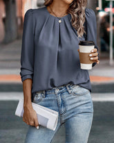 Blus med puffärmar och rejäl plättad